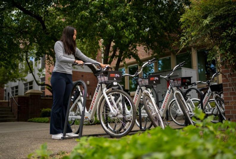 a student selects an e-bike from the on-campus hub