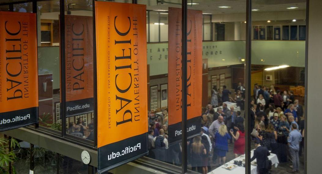 looking through the windows at an event in the student center